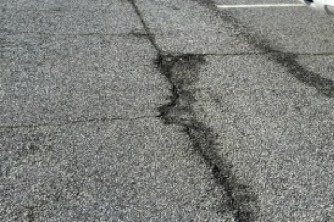cracked pavement in parking lot