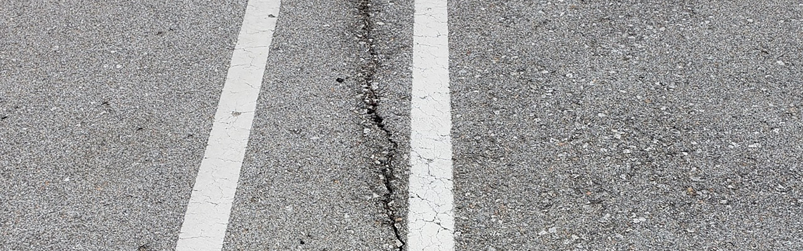 Crack in parking lot pavement