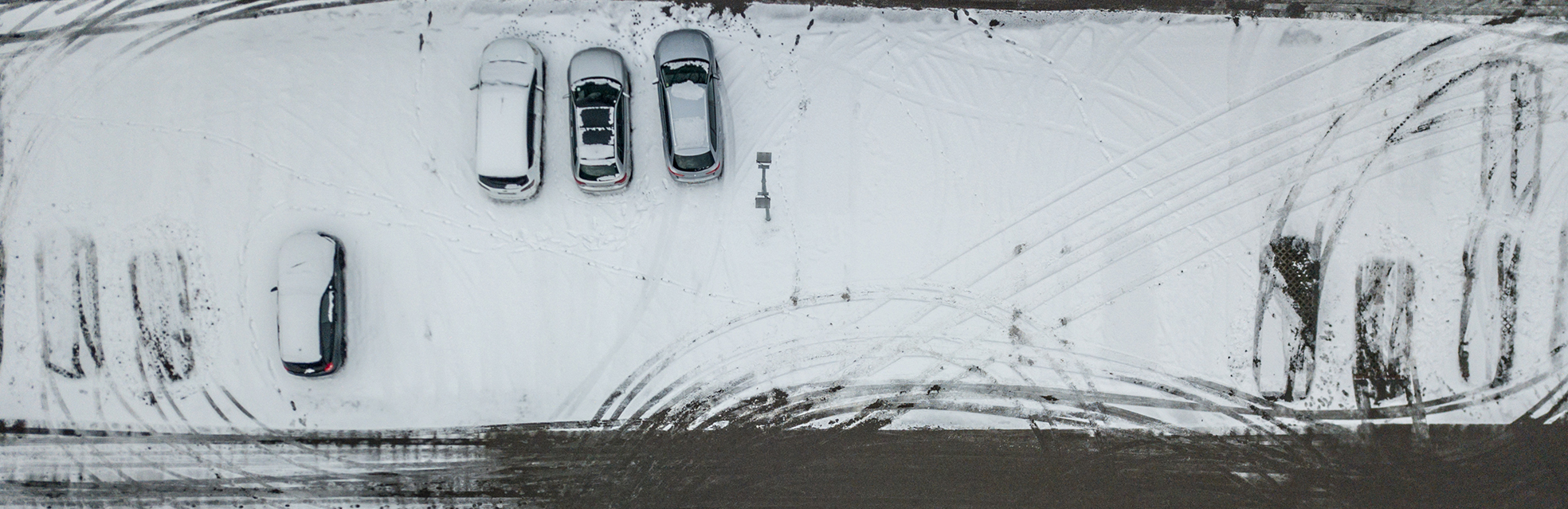 parking lot with snow and cars