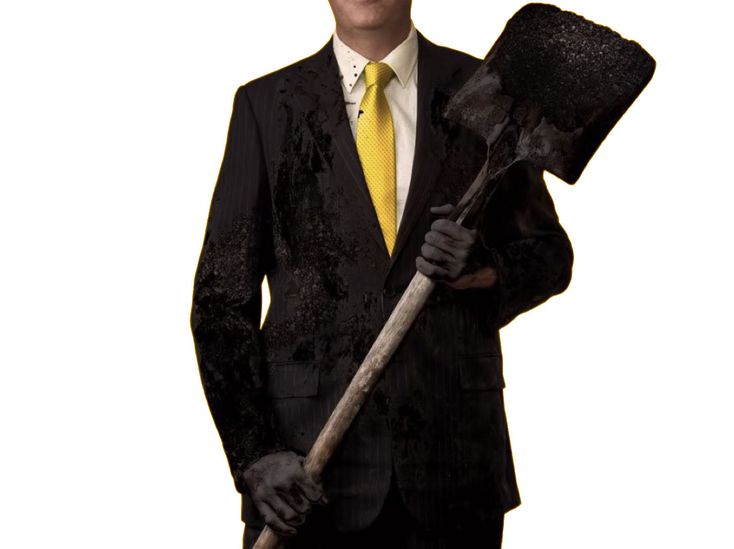 man in suite holding shovel