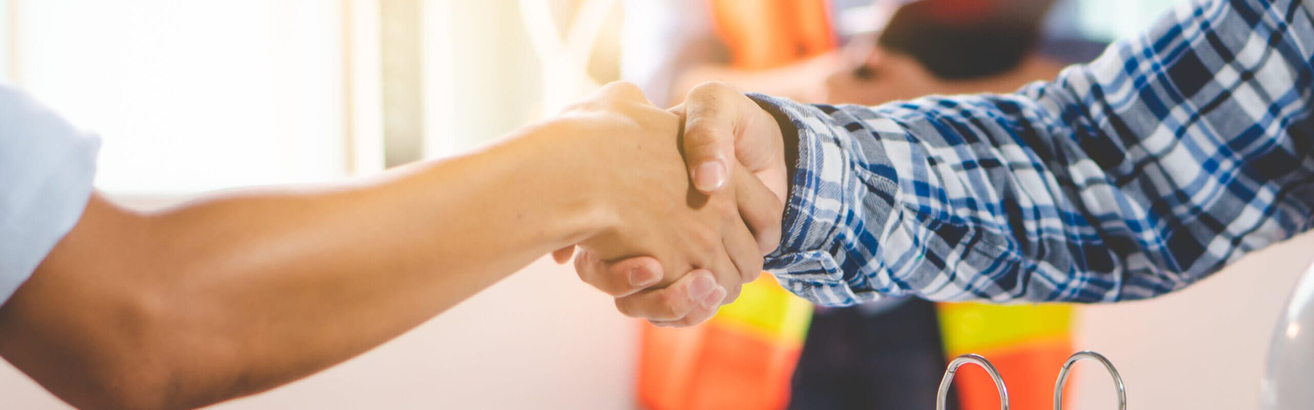 contractor shaking hand with client