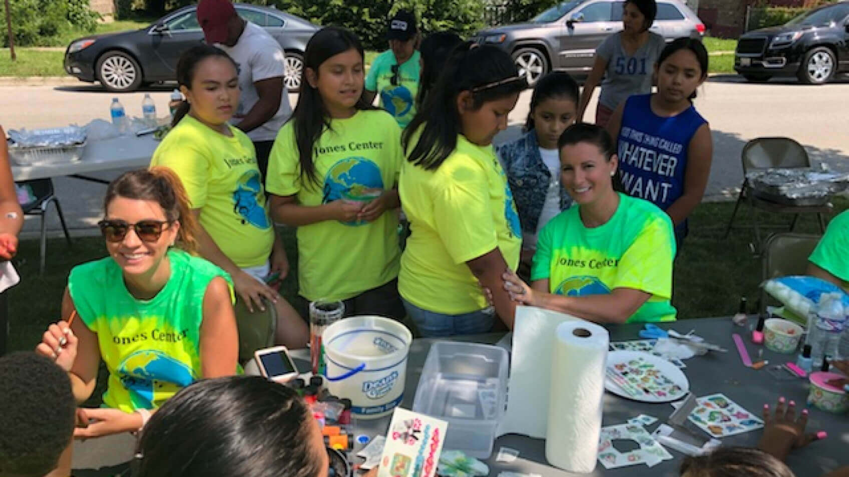 Let's Pave painting children's faces at volunteer event