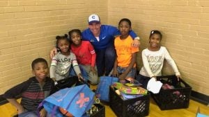 Let's Pave owner at volunteer event with children