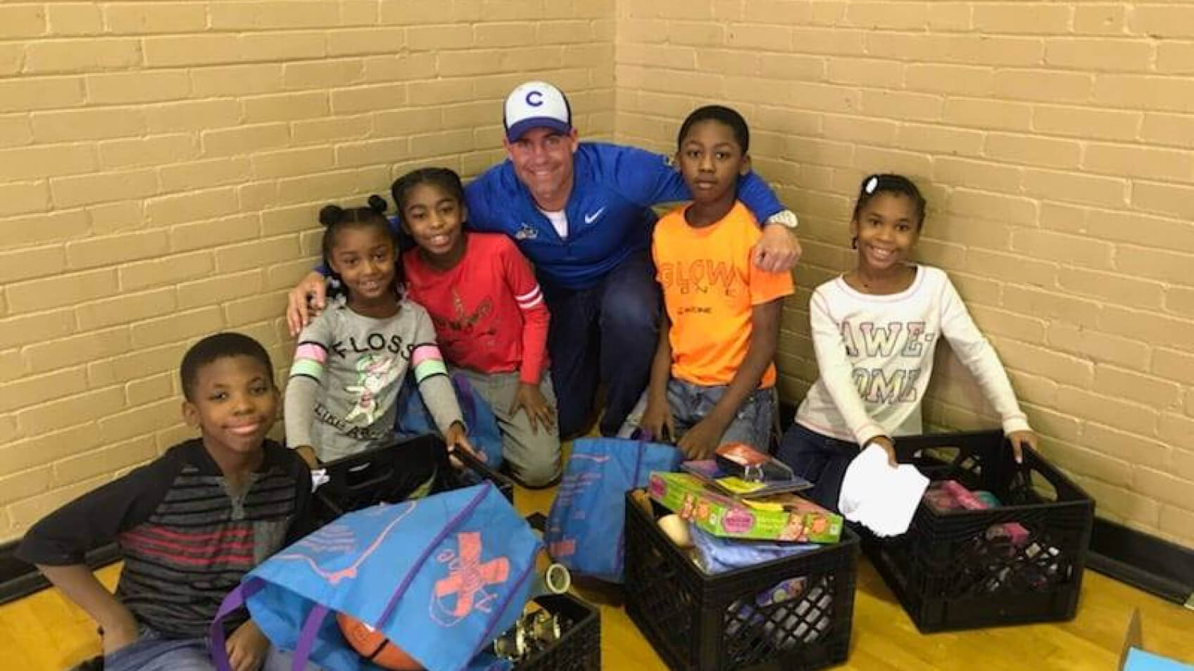 Let's Pave owner at volunteer event with children