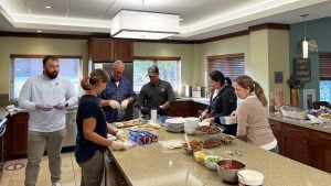 Let's Pave team preparing food to donate