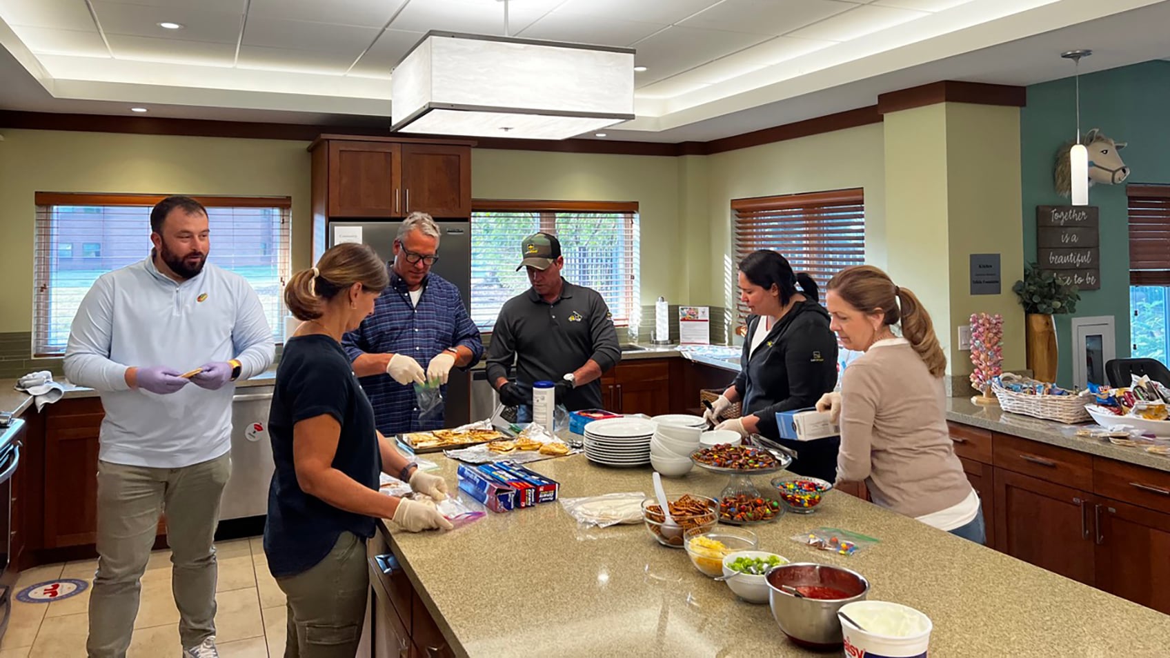 Let's Pave team preparing food to donate
