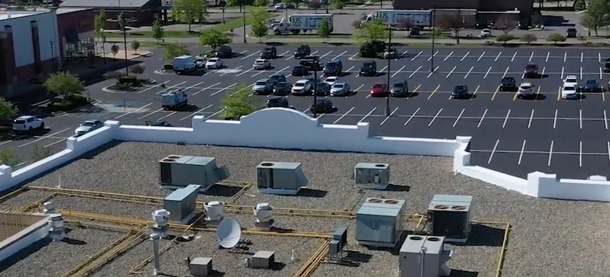 aerial view of commercial parking lot from roof
