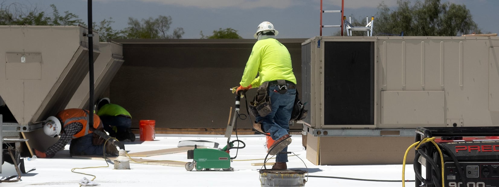Let's Roof performing TPO installation on a restaurant roof